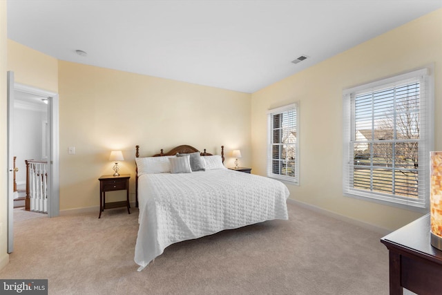 bedroom featuring light colored carpet