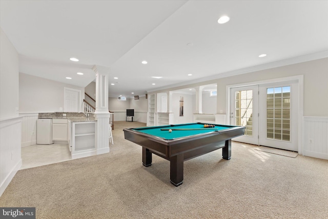 recreation room with french doors, crown molding, pool table, light colored carpet, and decorative columns