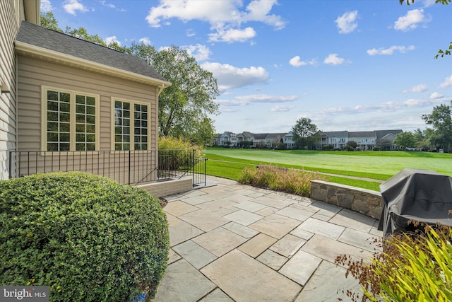 view of patio featuring a grill