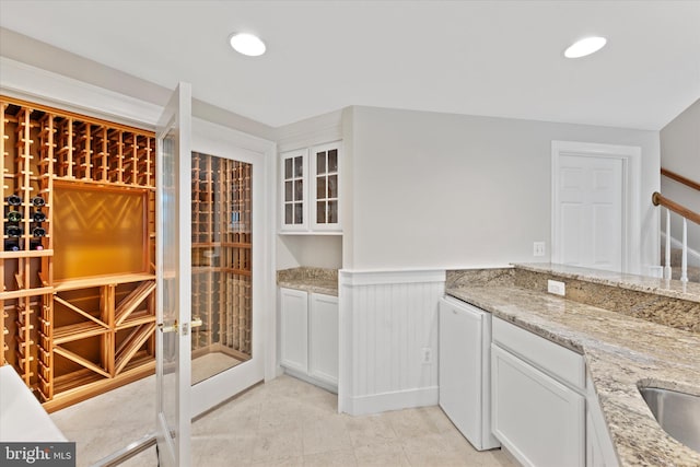 wine cellar with light tile patterned flooring