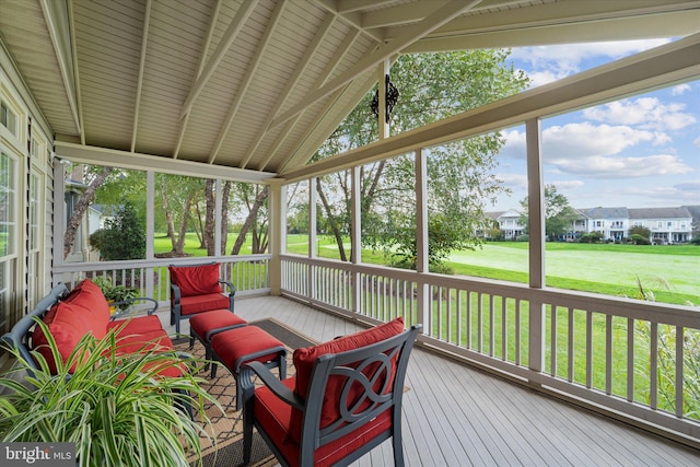 sunroom / solarium with lofted ceiling