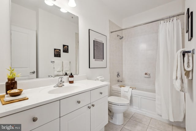 full bathroom with vanity, shower / tub combo with curtain, tile patterned floors, and toilet