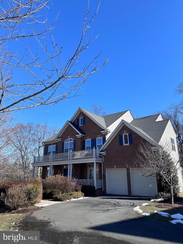 view of front of property with a garage and covered porch