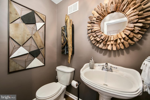 bathroom with sink and toilet