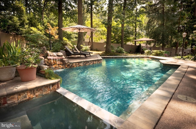 view of swimming pool featuring pool water feature