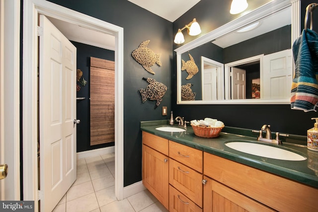 bathroom featuring tile patterned flooring and vanity