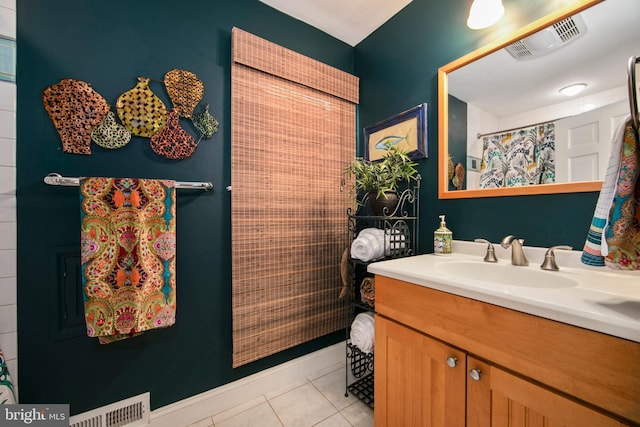 bathroom featuring a shower with curtain, vanity, and tile patterned flooring