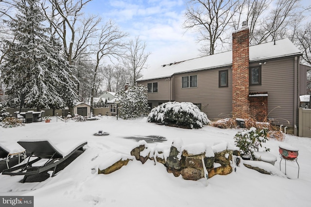 view of yard layered in snow