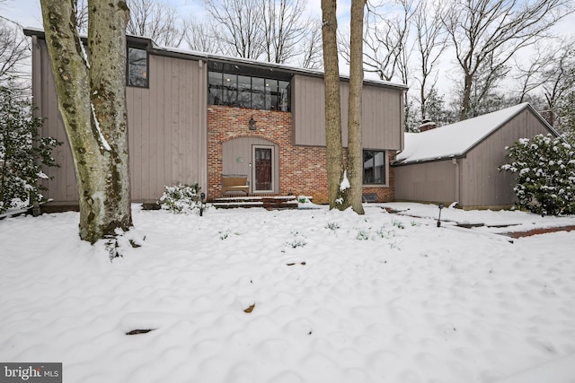 view of snow covered house