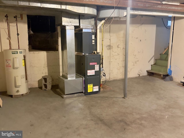 utility room featuring electric water heater and heating unit