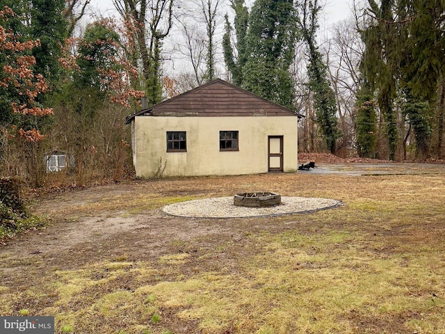 view of yard with an outdoor fire pit