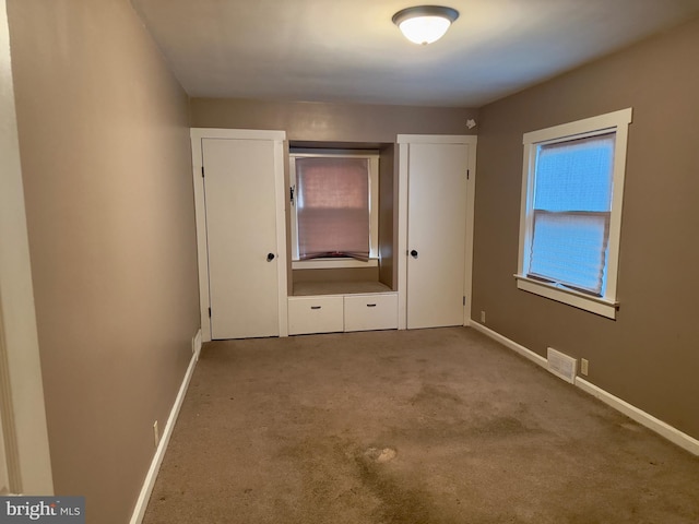 spare room with light carpet