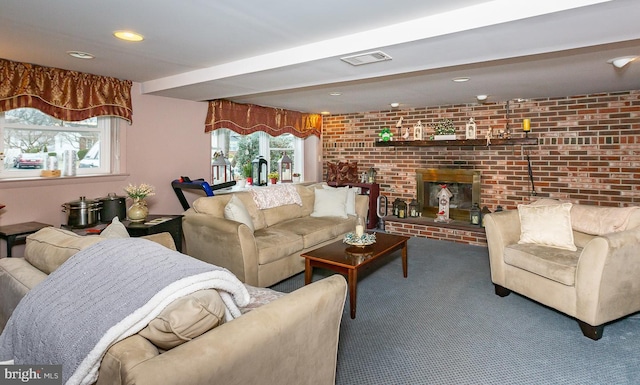 living room featuring brick wall, carpet flooring, beam ceiling, and a brick fireplace