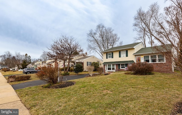 tri-level home featuring a front yard