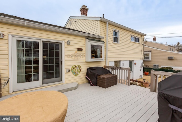 wooden terrace with area for grilling and central AC