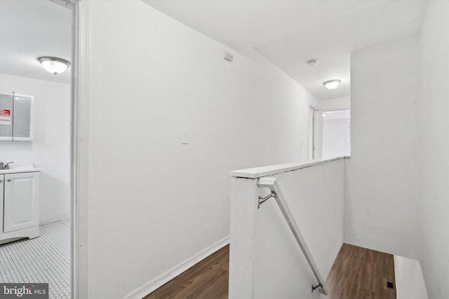 hallway with dark hardwood / wood-style floors