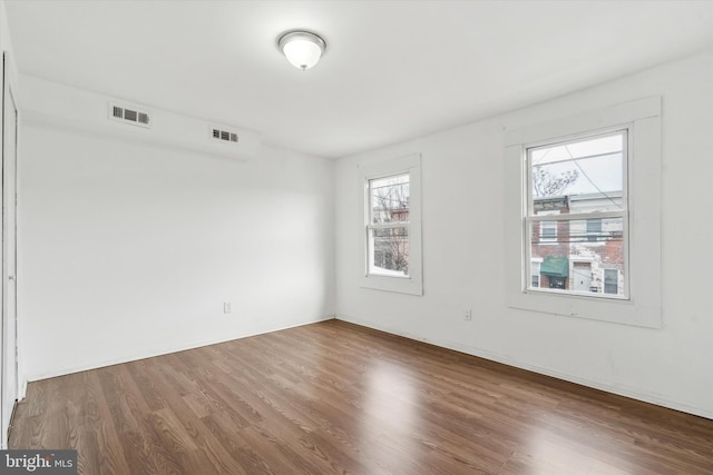 unfurnished room featuring wood-type flooring