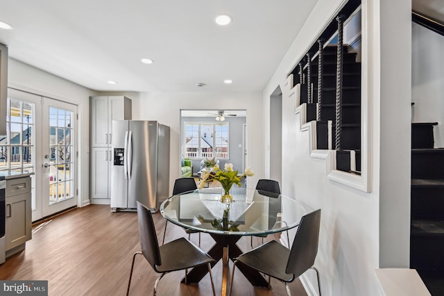 dining area featuring recessed lighting, french doors, and light wood-style floors