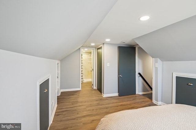 bedroom featuring recessed lighting, wood finished floors, and baseboards