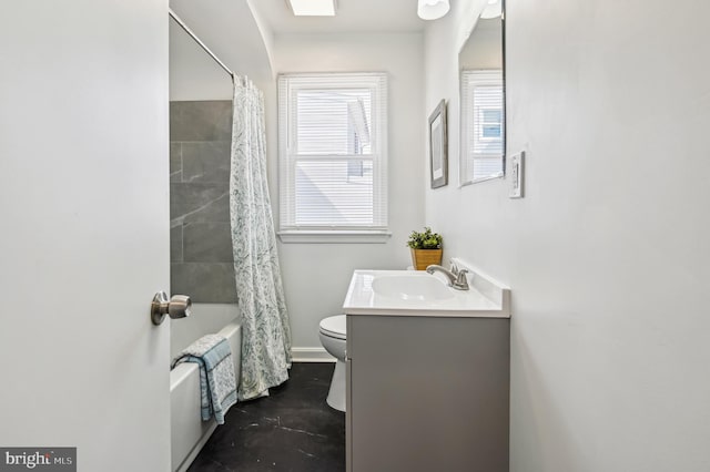 bathroom featuring shower / bath combination with curtain, toilet, vanity, and baseboards