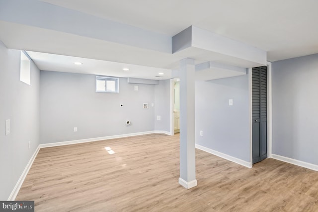 basement with recessed lighting, light wood-type flooring, and baseboards