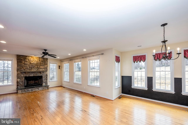 unfurnished living room featuring a healthy amount of sunlight and light wood-type flooring