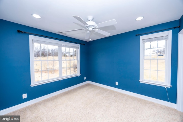 unfurnished room featuring carpet floors and ceiling fan