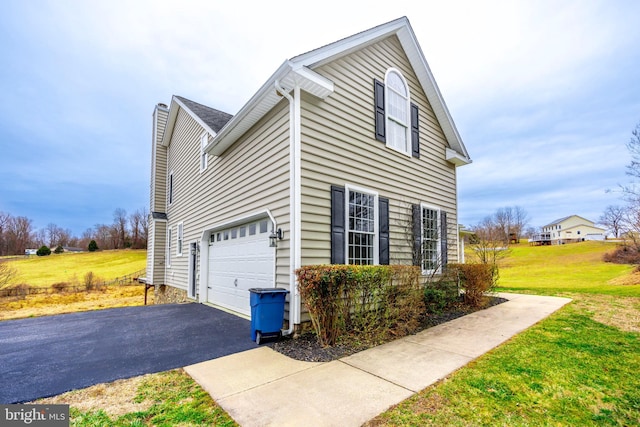 view of property exterior with a lawn