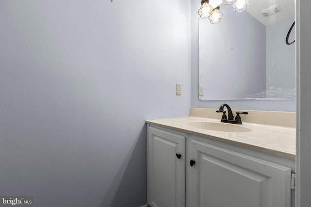 bathroom featuring visible vents and vanity