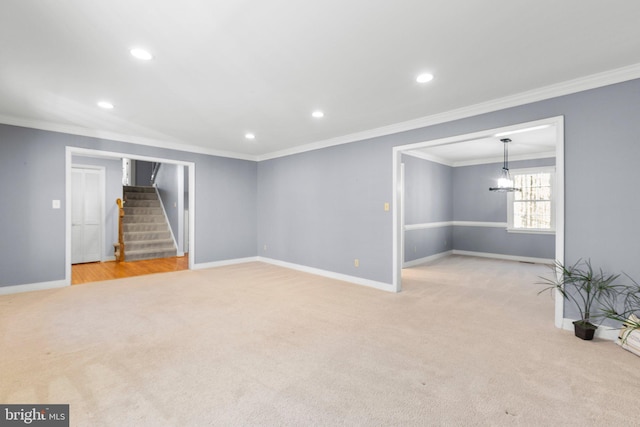 interior space with stairs, light carpet, and baseboards