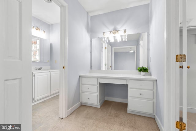 full bath featuring carpet floors, baseboards, and vanity