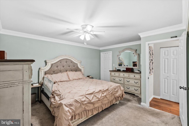 carpeted bedroom featuring ornamental molding and ceiling fan