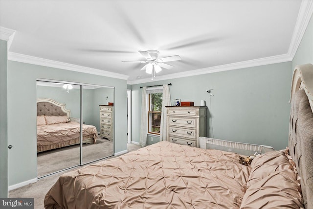 carpeted bedroom with crown molding, ceiling fan, and a closet