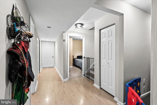 hall with light hardwood / wood-style flooring