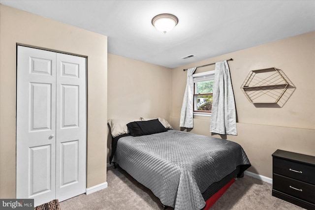 carpeted bedroom featuring a closet