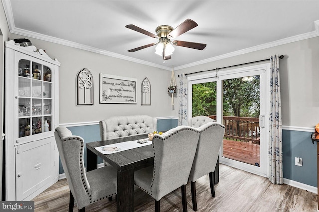 dining space with crown molding, ceiling fan, and light hardwood / wood-style floors