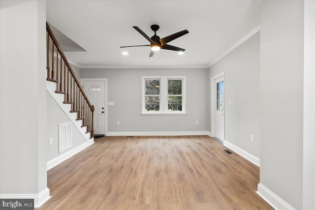 unfurnished living room featuring crown molding, light hardwood / wood-style floors, and ceiling fan