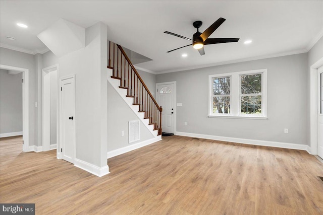 unfurnished living room featuring crown molding, light hardwood / wood-style floors, and ceiling fan