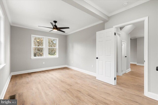 spare room featuring crown molding, ceiling fan, and light wood-type flooring