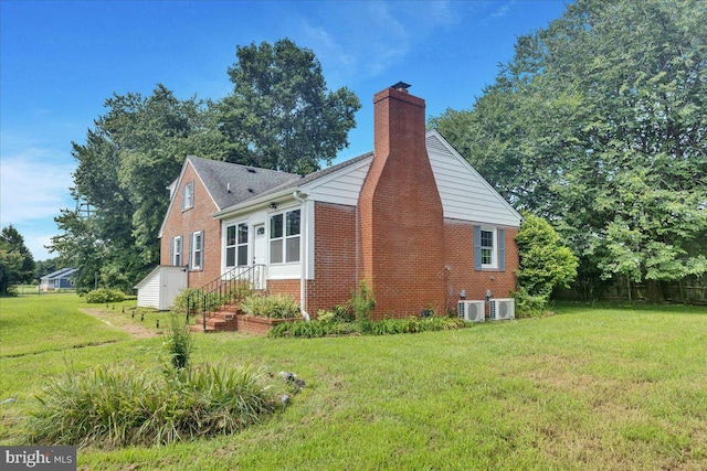 view of home's exterior with a yard