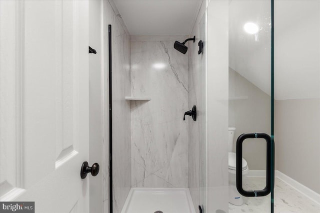 bathroom with lofted ceiling, toilet, and walk in shower