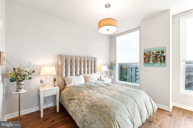 bedroom with wood-type flooring