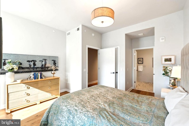 bedroom with wood-type flooring