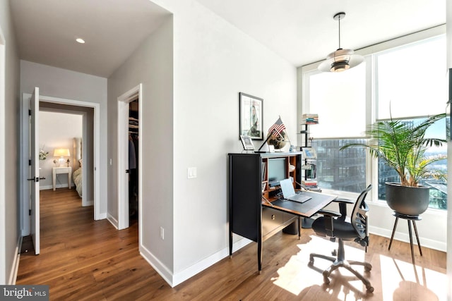 home office with wood-type flooring