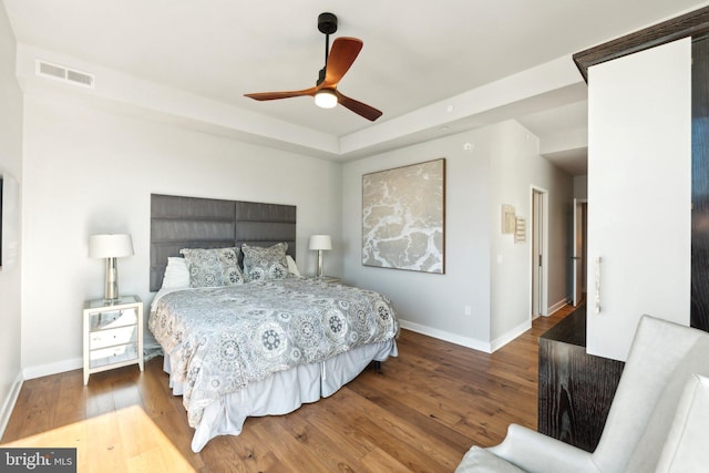 bedroom with hardwood / wood-style flooring and ceiling fan