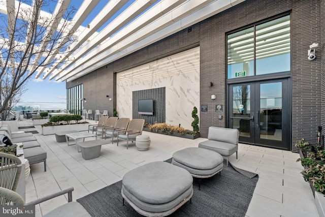 view of patio featuring an outdoor living space and french doors