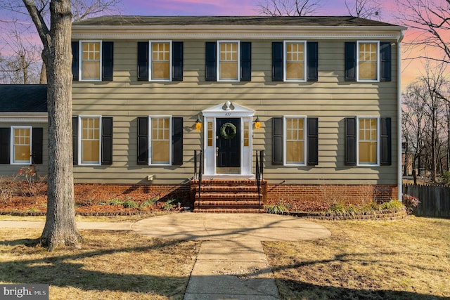 colonial house with a patio area