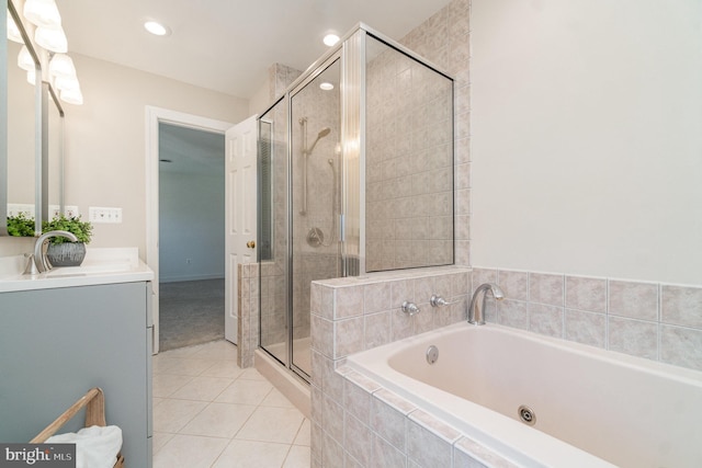 bathroom featuring tile patterned flooring, vanity, and independent shower and bath