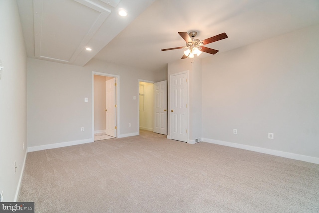 unfurnished bedroom featuring ceiling fan and light colored carpet