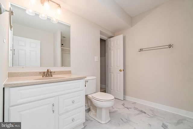 bathroom featuring vanity, a shower, and toilet